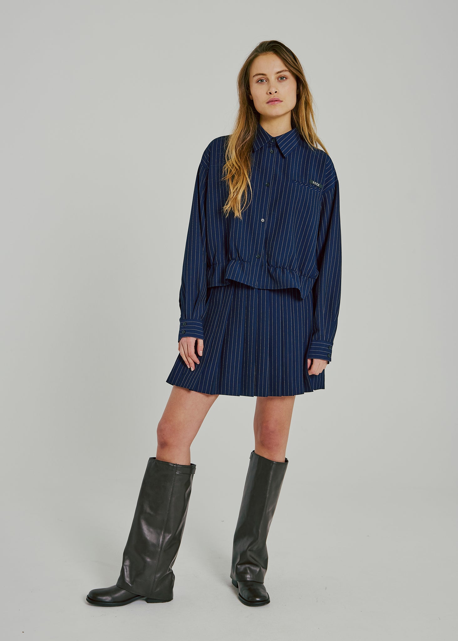 Neo pinstripe pleat skirt in navy pinstripe
