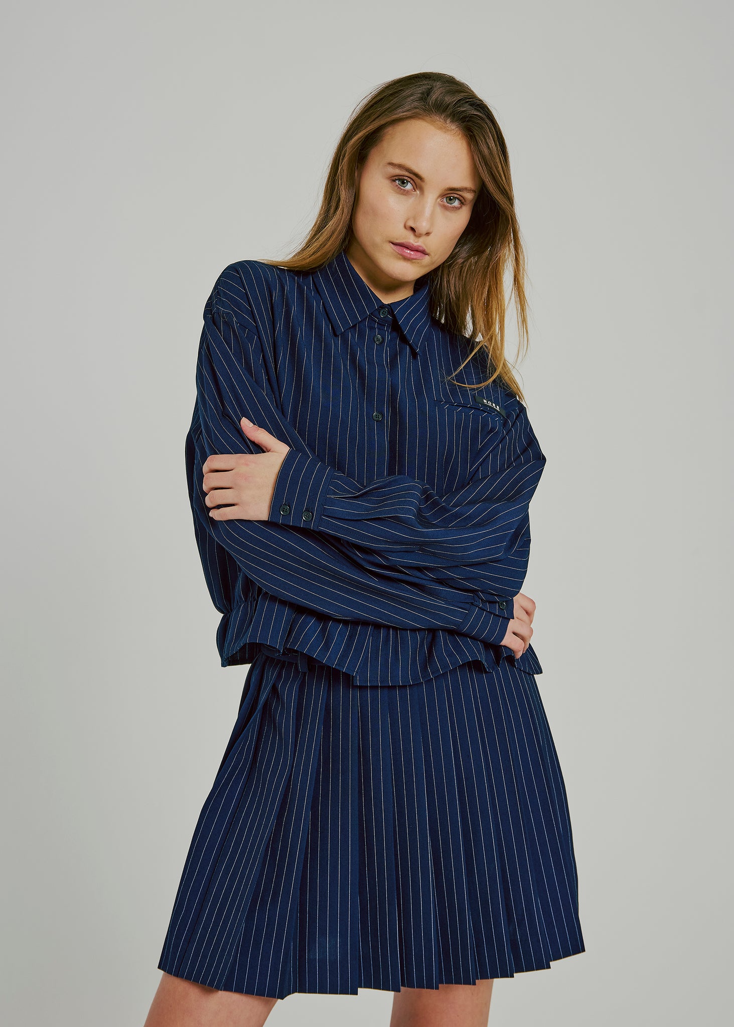 Neo pinstripe pleat skirt in navy pinstripe