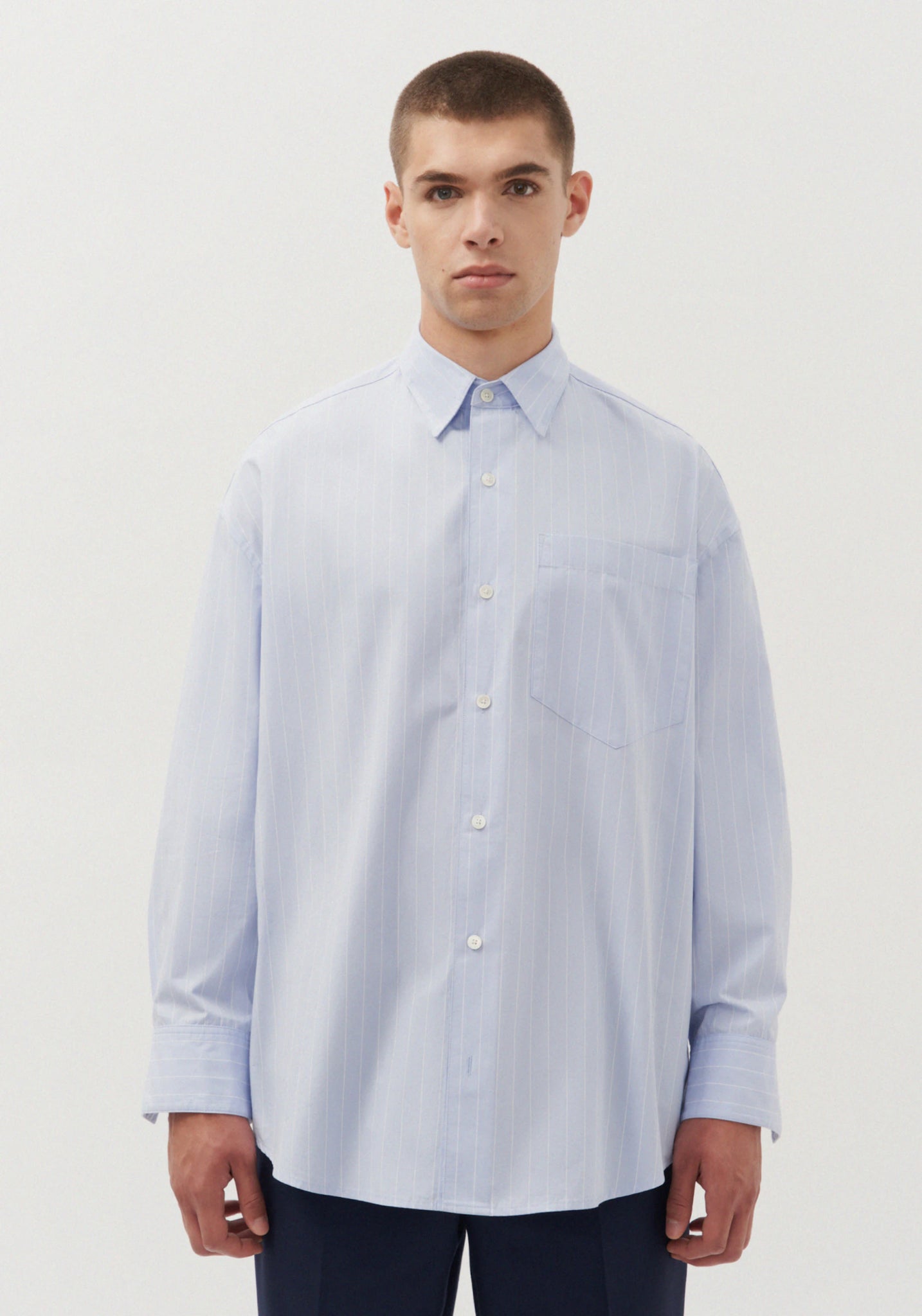 Gender neutral oversized shirt in blue stripes by Studio Seidensticker