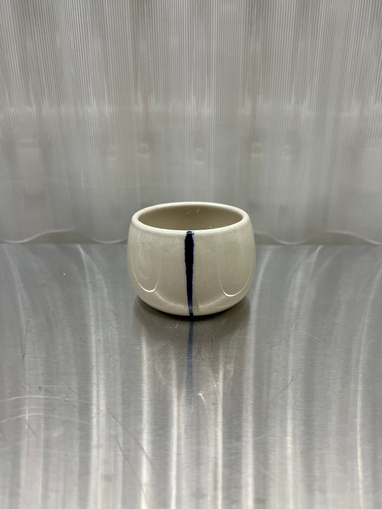 Small cup in white with blue stripe by Jimu Kobayashi
