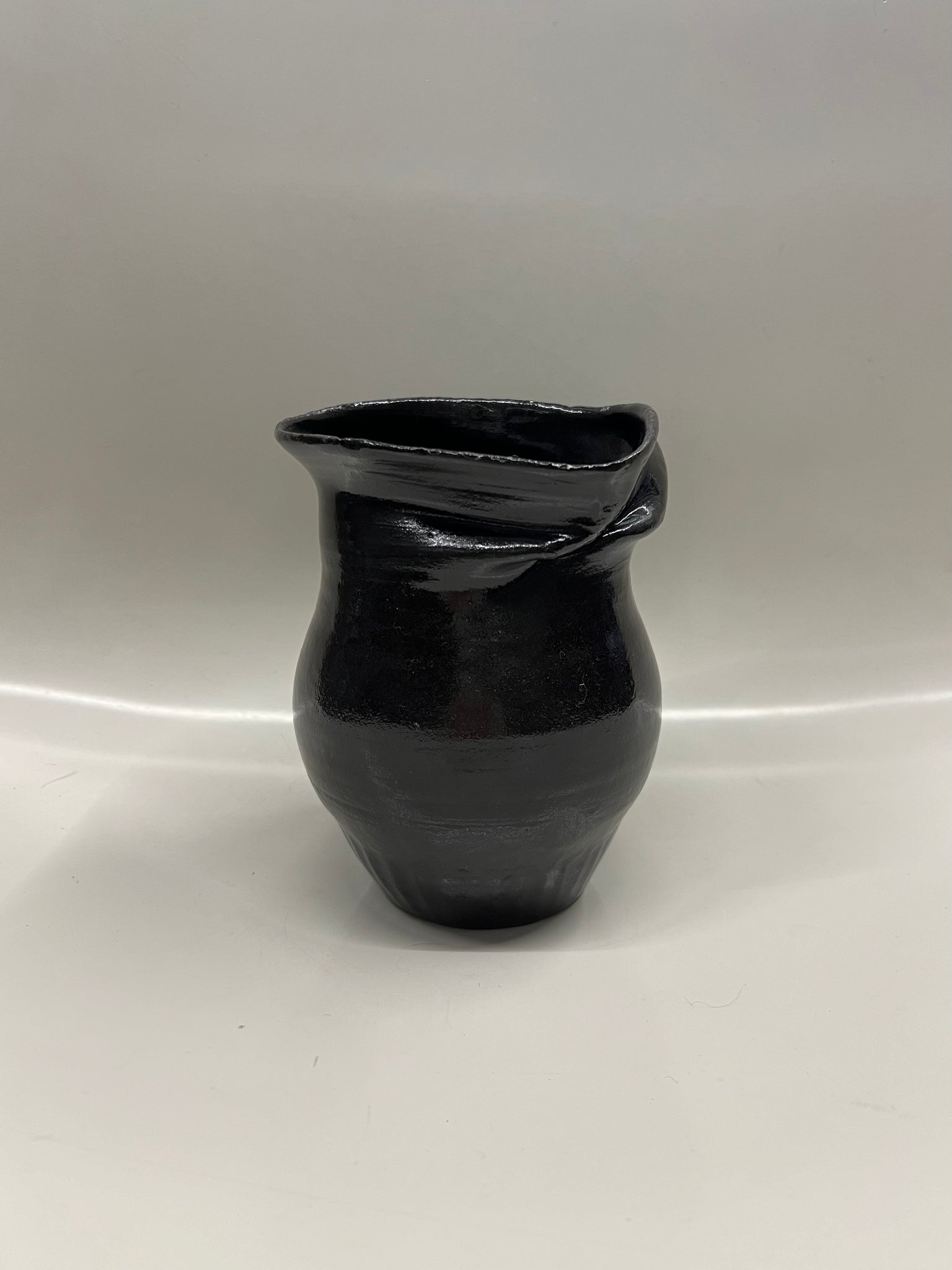 Deformed glazed vase in black by Jimu Kobayashi