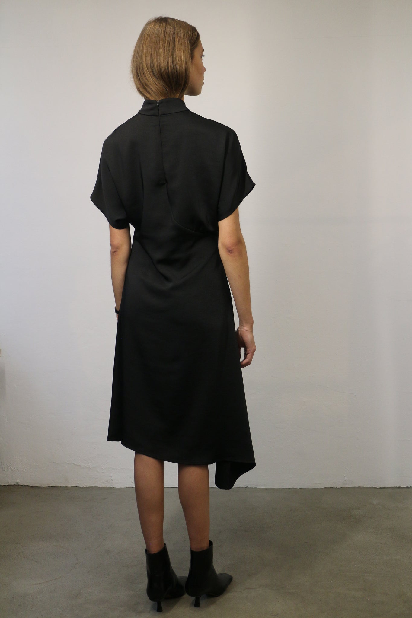 ASYMMETRICAL SATIN DRESS IN BLACK BY NORR